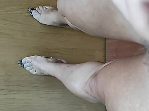 Joana V0mit showing legs and cock w blue dress and heels