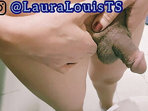 Lovely Ladyboy Laura pees and takes a shower